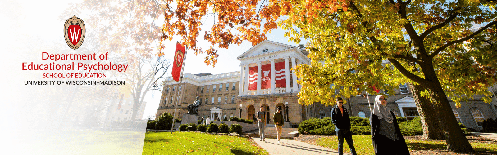 Students are walking on the sidewalk with Bascom Hall in the background and trees changing to fall colors. To the left of the photo is the UW-Madison crest with the words "Department of Educational Psychology, School of Education, University of Wisconsin-Madison"