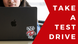 Student using a computer with a UW–Madison Bucky sticker displayed on the laptop. To the right of a photo are the words "Take a Test Drive"
